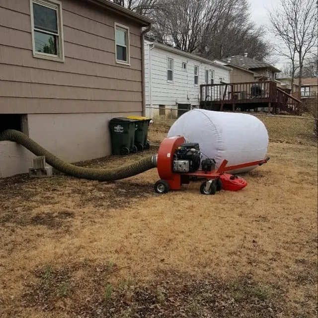 Truck-mounted duct cleaning equipment outside a Kansas City home